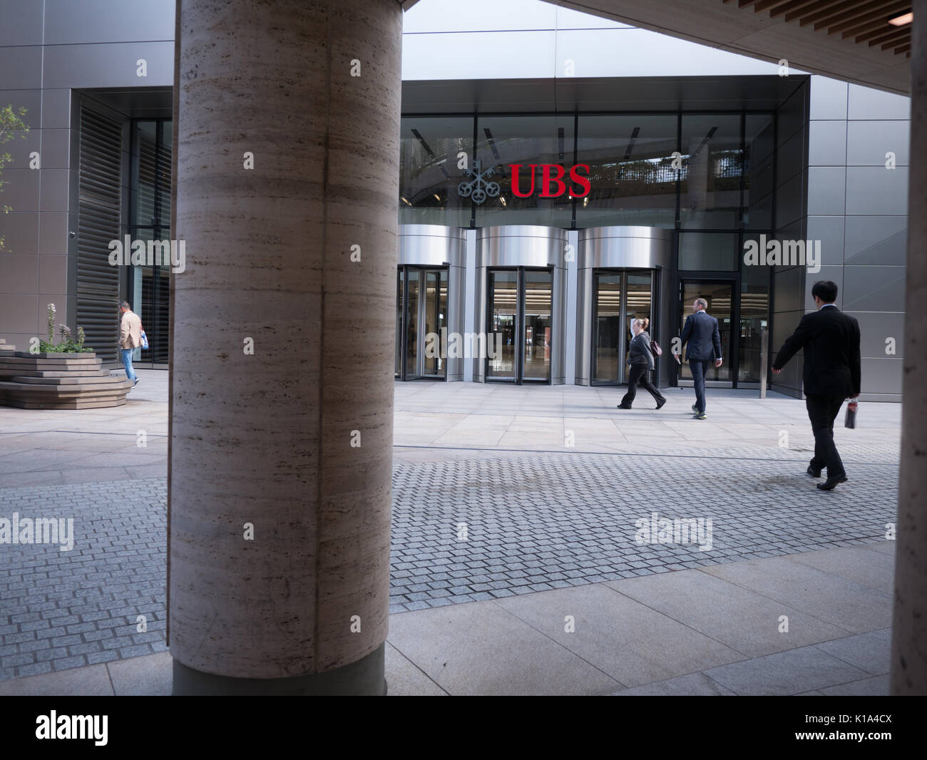 Pedestrians and office workers walk past, UBS headquarters, Broadgate, London Stock Photo