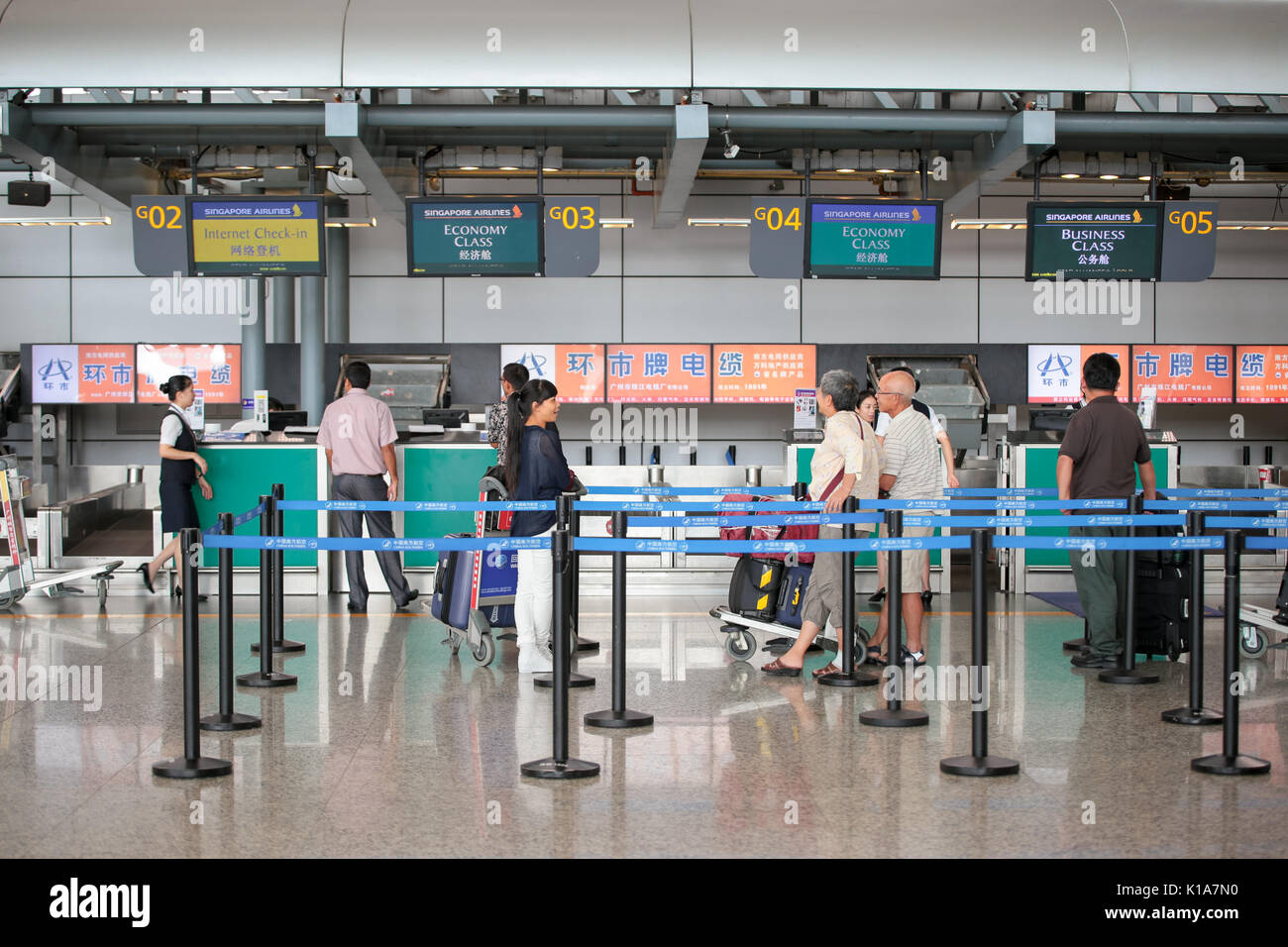 Check in counters at Gaungzhou Baiyun International Airport, Guangdong China. Stock Photo