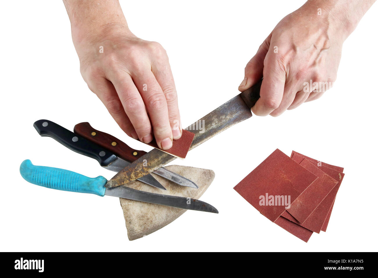 https://c8.alamy.com/comp/K1A7N5/old-elderly-master-tries-to-sharpen-rusty-kitchen-knives-on-his-desktop-K1A7N5.jpg