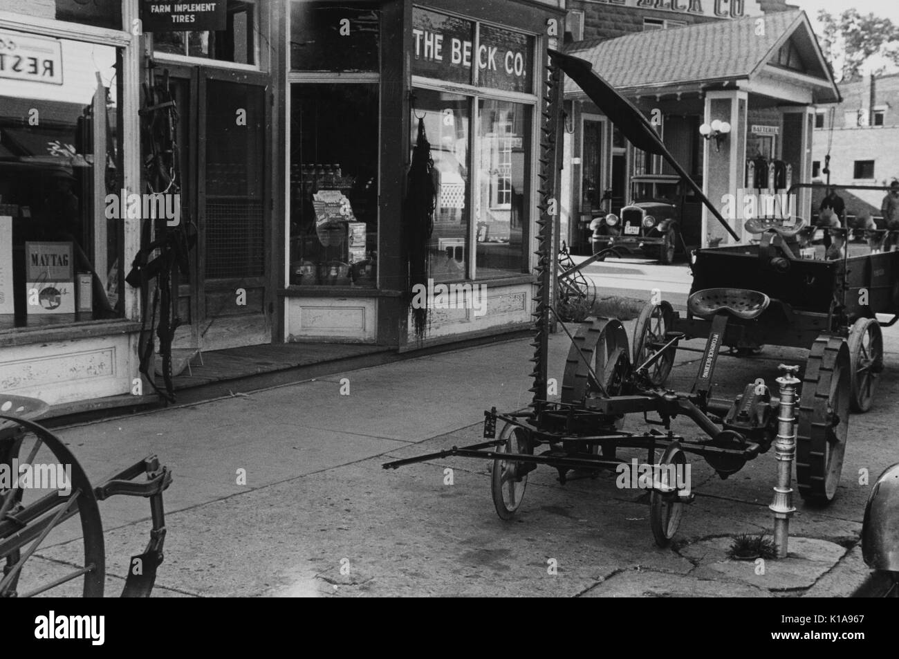 Farm implements outside store, Canal Winchester, Ohio, 1938. From the