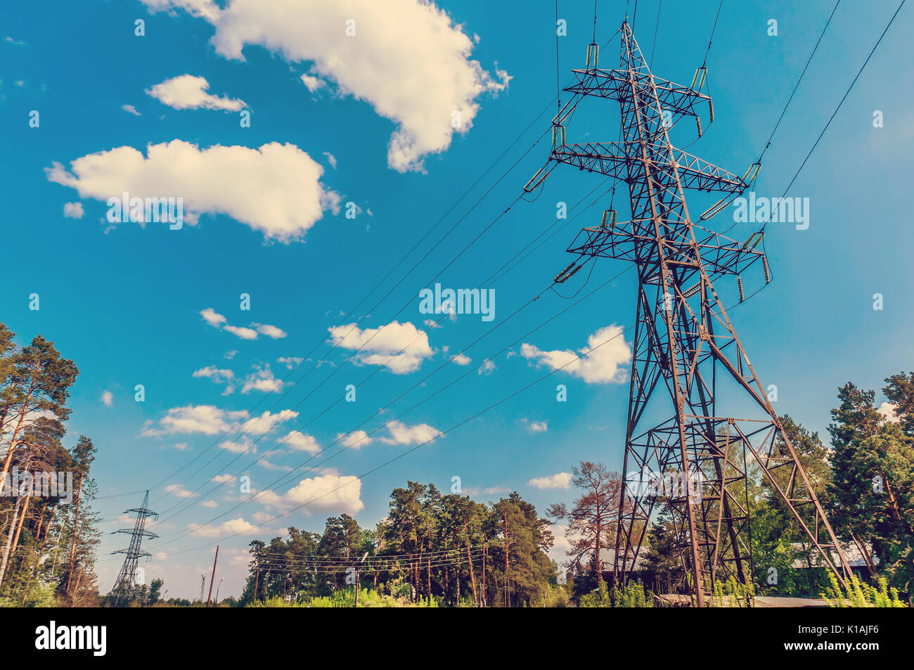 High-voltage power line in the field. Toned image Stock Photo - Alamy