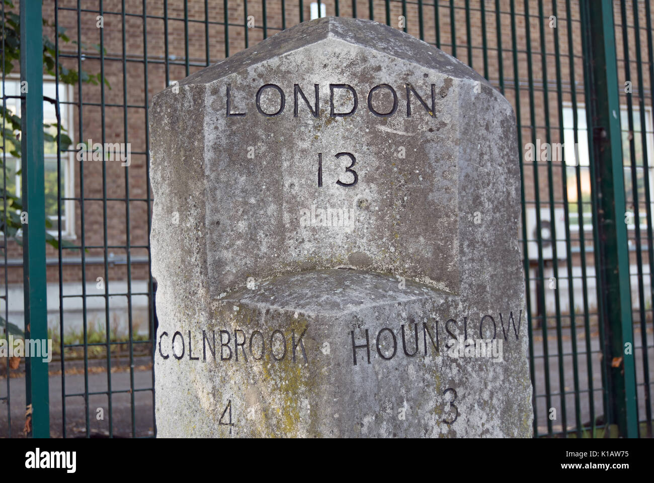 milestone at harlington corner, near heathrow airport, london, england, showing distances in miles to central london, colnbrook and hounslow Stock Photo