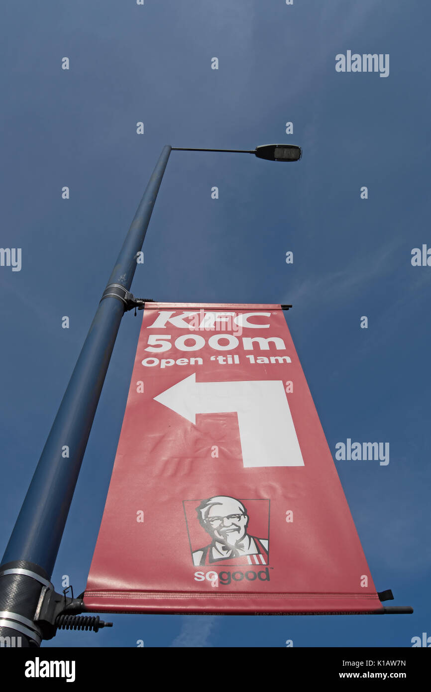 left pointing banner sign for a branch of kfc near heathrow airport, london, england Stock Photo