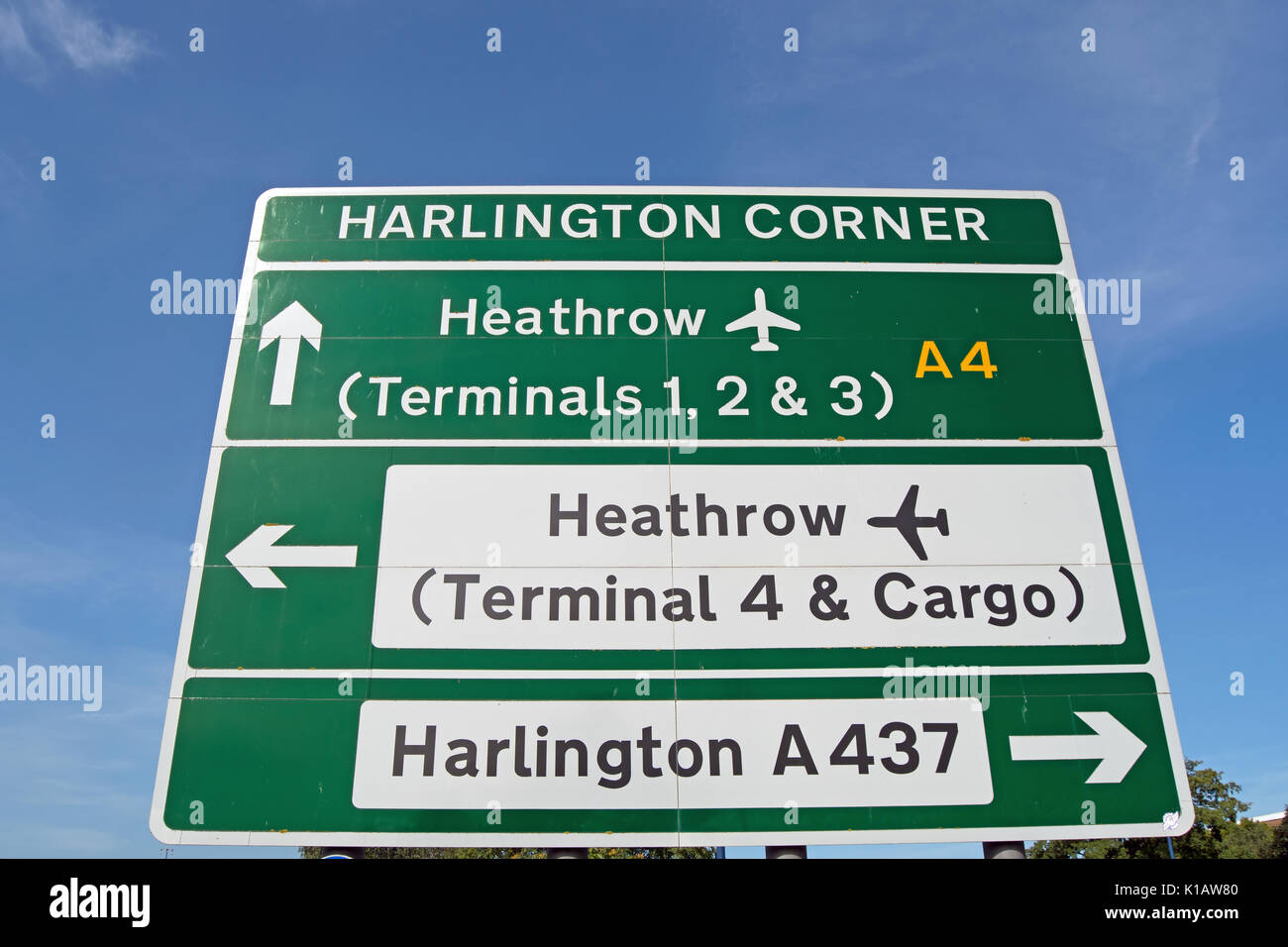 road sign on the A4 at harlington corner, west london, england, showing routes for harlington and heathrow airport terminals Stock Photo