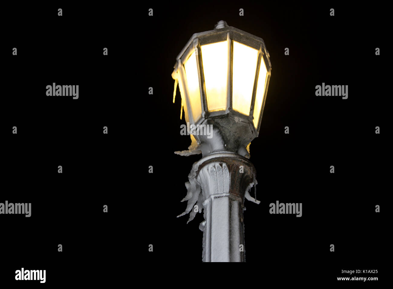 decorative street lamp covered by icicles, winter night Stock Photo Alamy