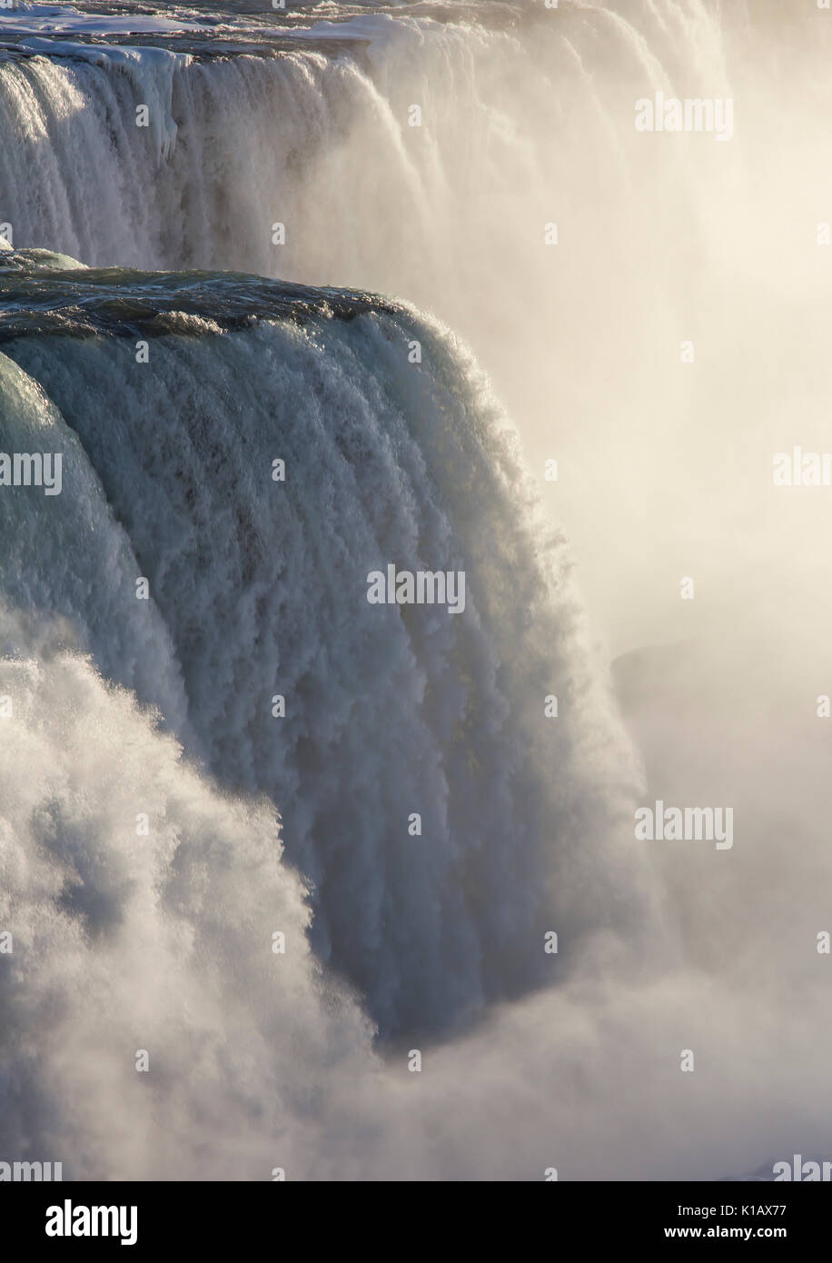 water falling down on Niagara Falls on the border Ontario river between the USA and Canada Ontario in winter time Stock Photo