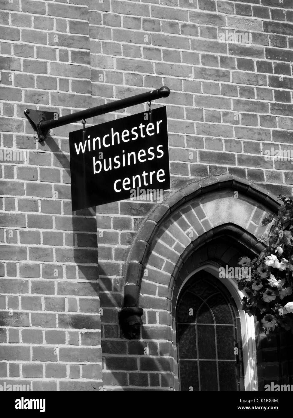 Business centre sign over premises, helping to promote and enhance businesses in the city Stock Photo