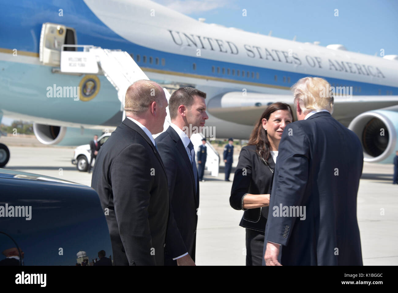 U.S. President Donald Trump, right, is welcomed by Homeland Security Acting Secretary Elaine Duke as Acting Customs and Border Patrol Commissioner Kevin McAleenan, center, and Acting CBP Director Tom Homan look on as he arrives for a tour of the Yuma Border Patrol Station August 22, 2017 in Yuma, Arizona. Stock Photo