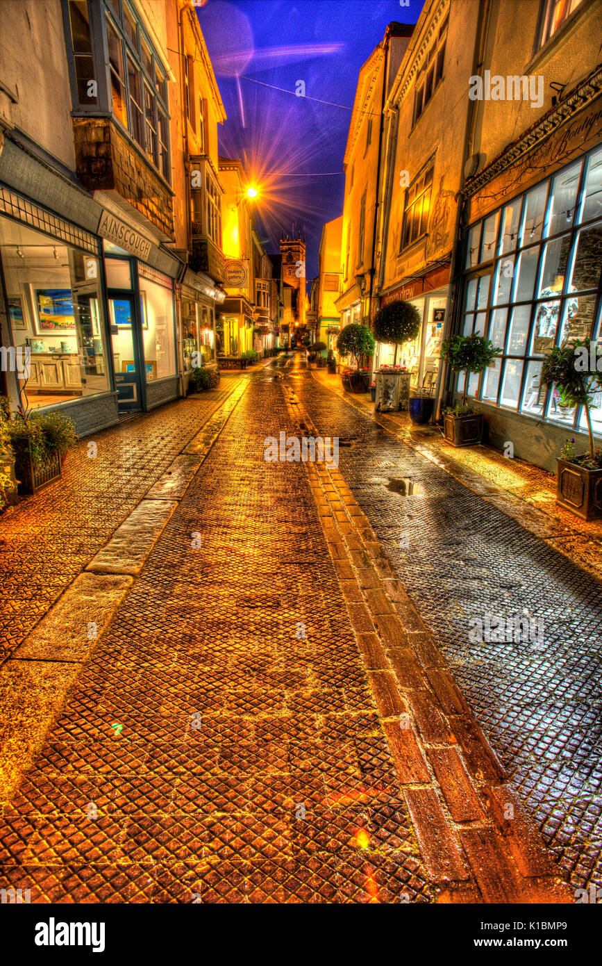 Town of Dartmouth, England. Picturesque night view of art and retails shops in Dartmouth’s Foss Street. Stock Photo