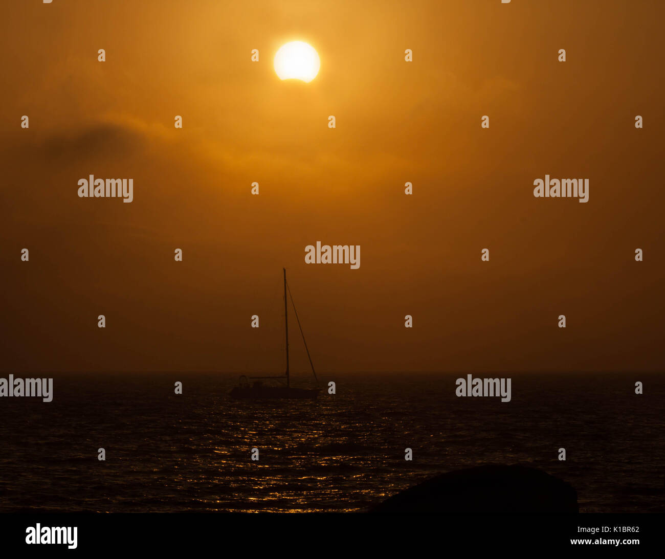 yacht sailing at sunset night lights Stock Photo