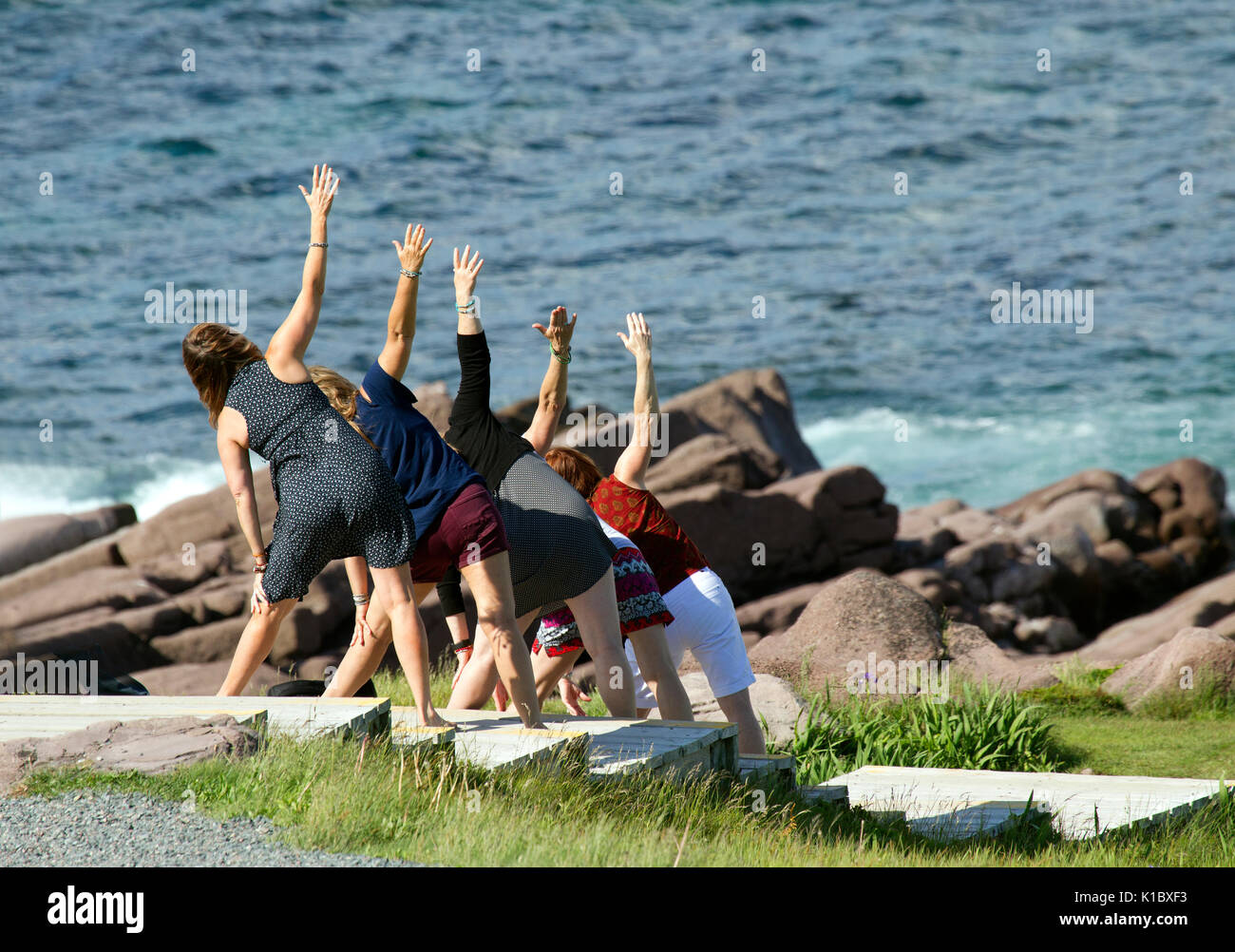 Five Women Exercising in Unison Stock Photo