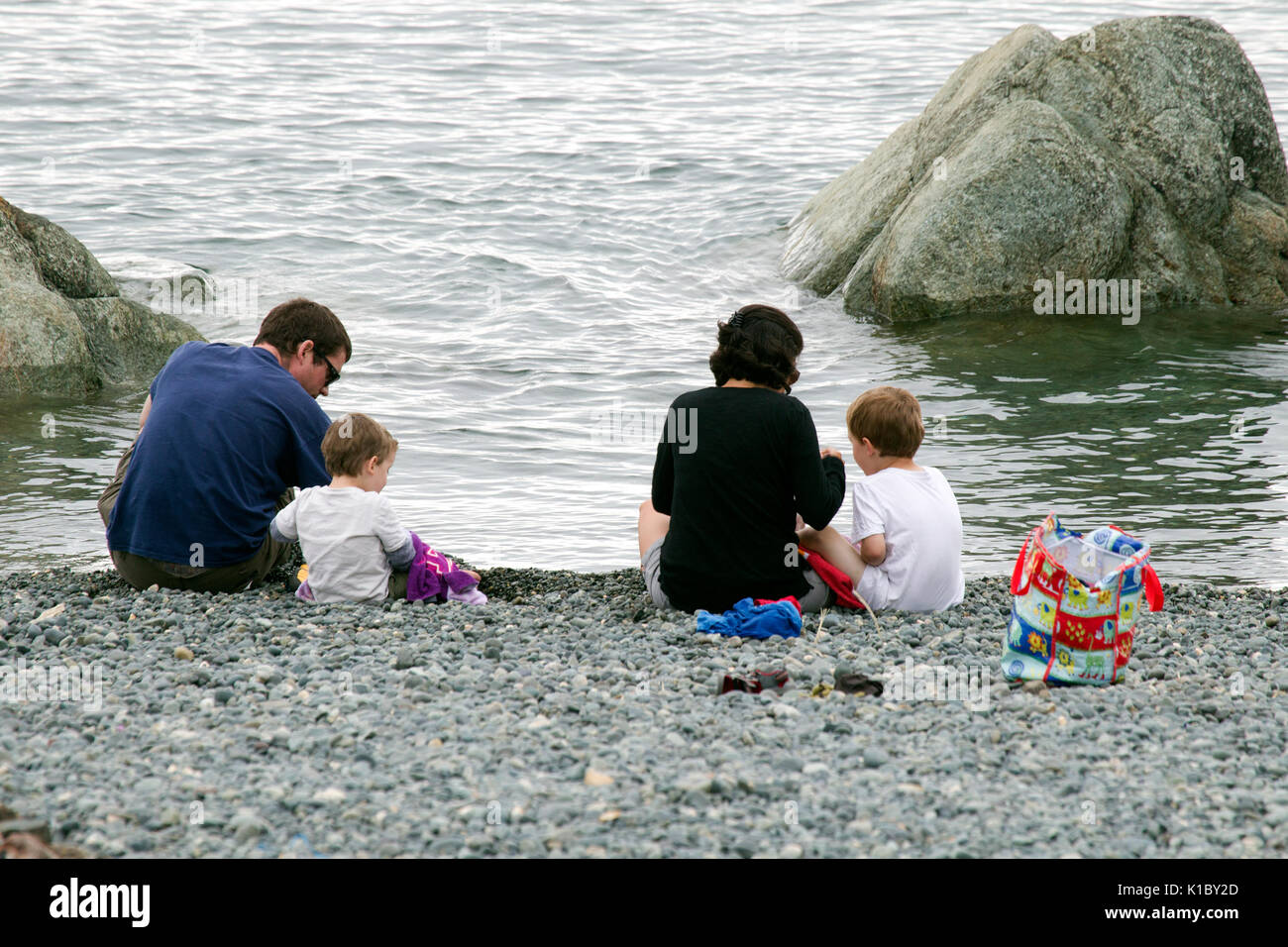 Family of Four at the Seashore Stock Photo