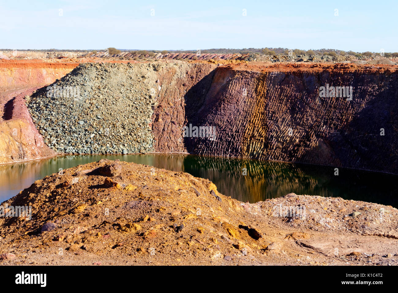 Abandoned open cut gold mine filling with water, Cue, Murchison