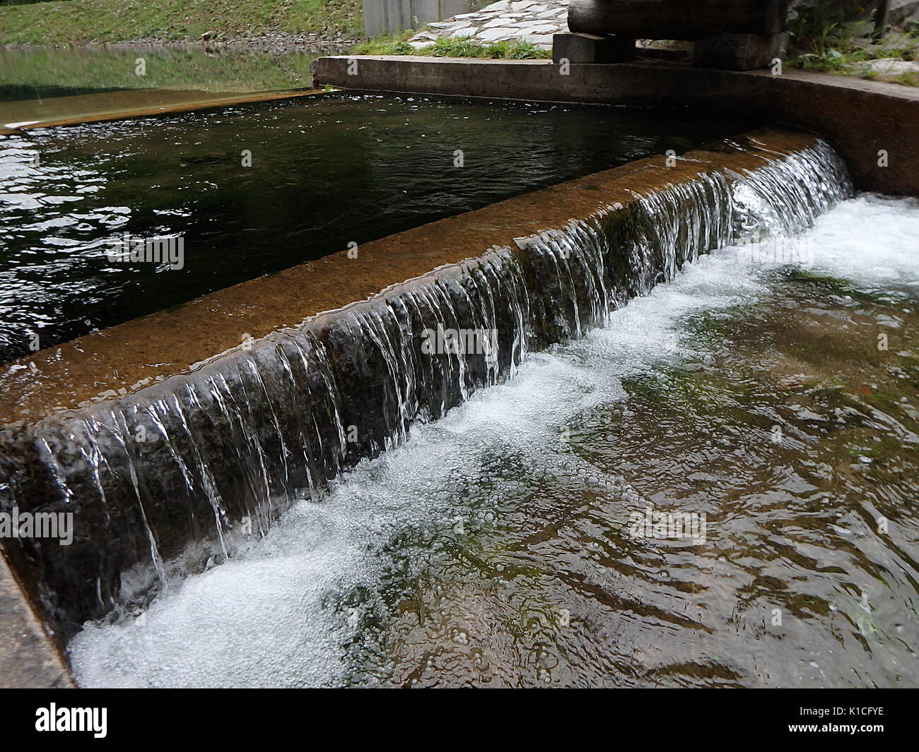 small waterfall, artificial cascade on the river, Stock Photo