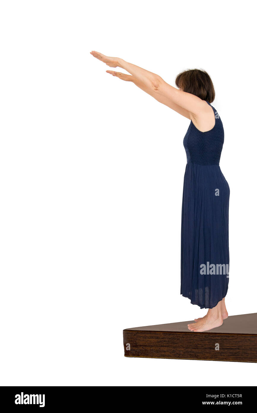 Woman taking the plunge, white background. The decision to act, decisive moment. Stock Photo