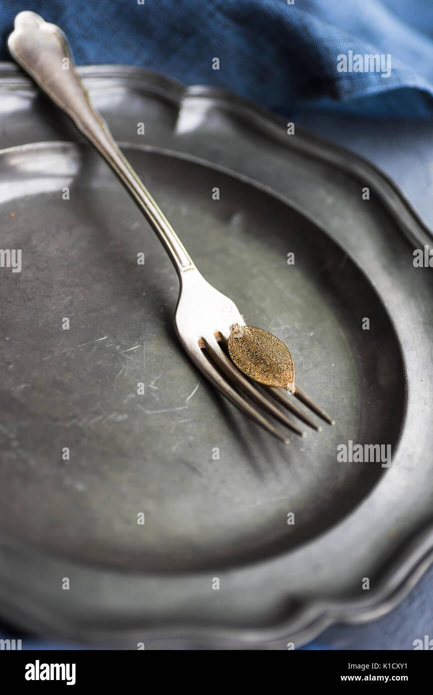 Autumnal table setting with golden autumn leave on concrete background Stock Photo