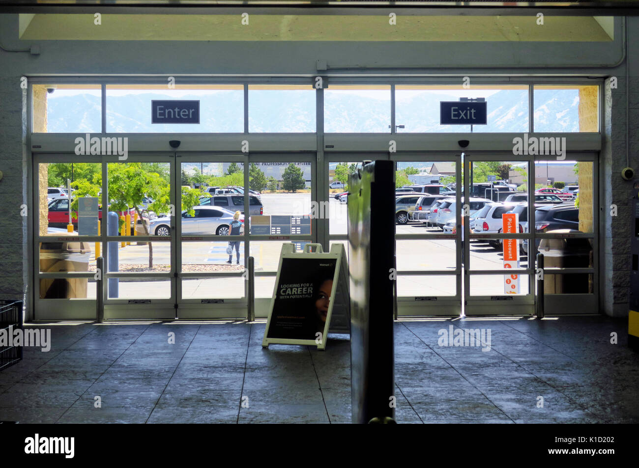 Door store: the doors store An empty entrance and exit to a Walmart superstore looking out into the parking lot Stock Photo