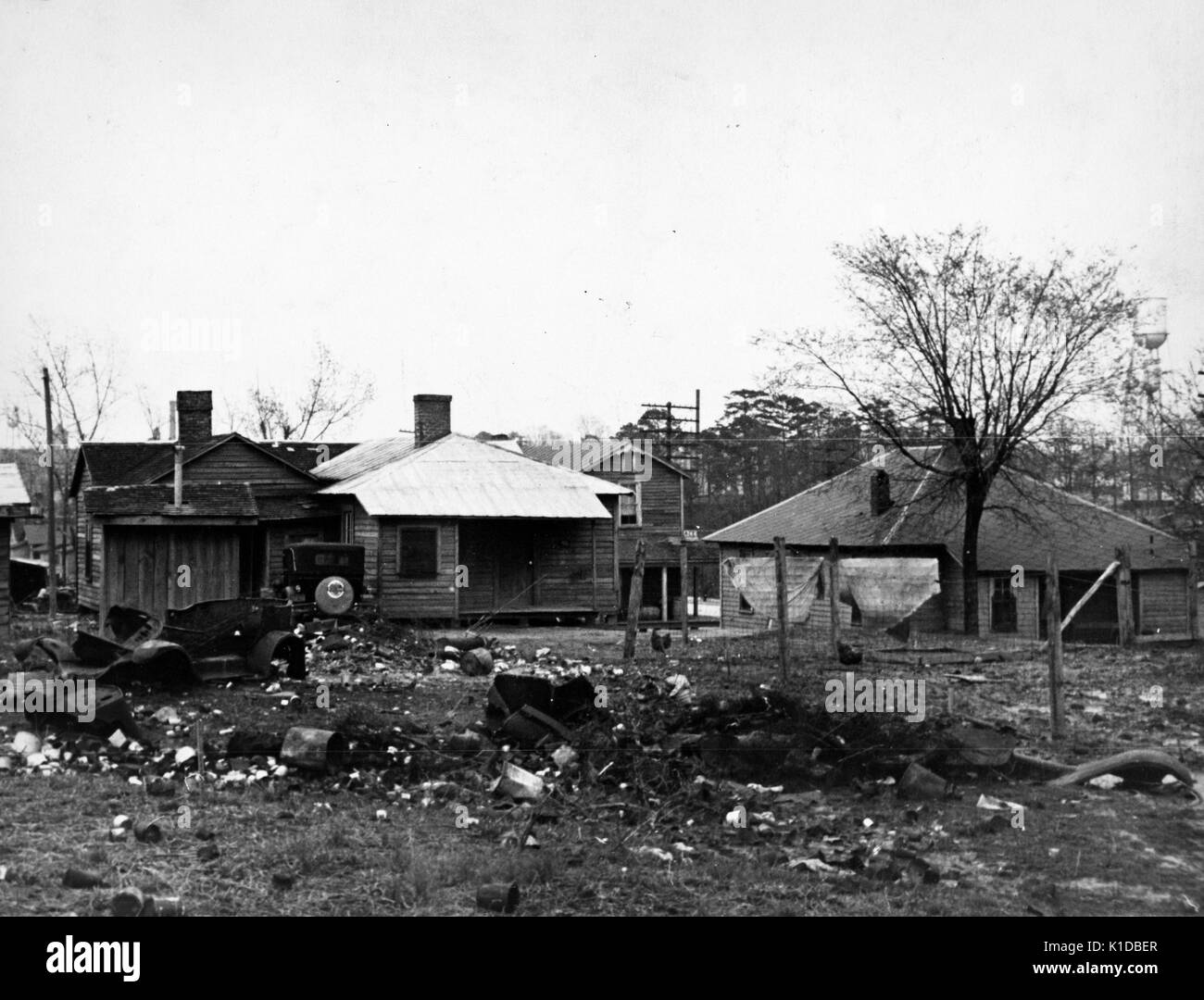 Dilapidated farm homes surrounded with debris, Tennessee, 1935. From the New York Public Library. Stock Photo