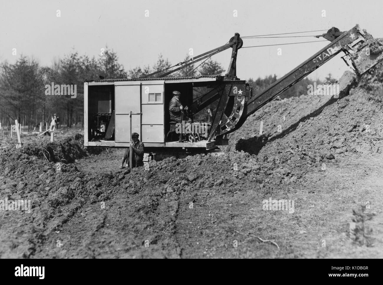 Mechanical digger working on cellar foundation at a Farm Security Administration housing unit at the Berwyn project, Greenbelt, Maryland, 1936. From the New York Public Library. Stock Photo