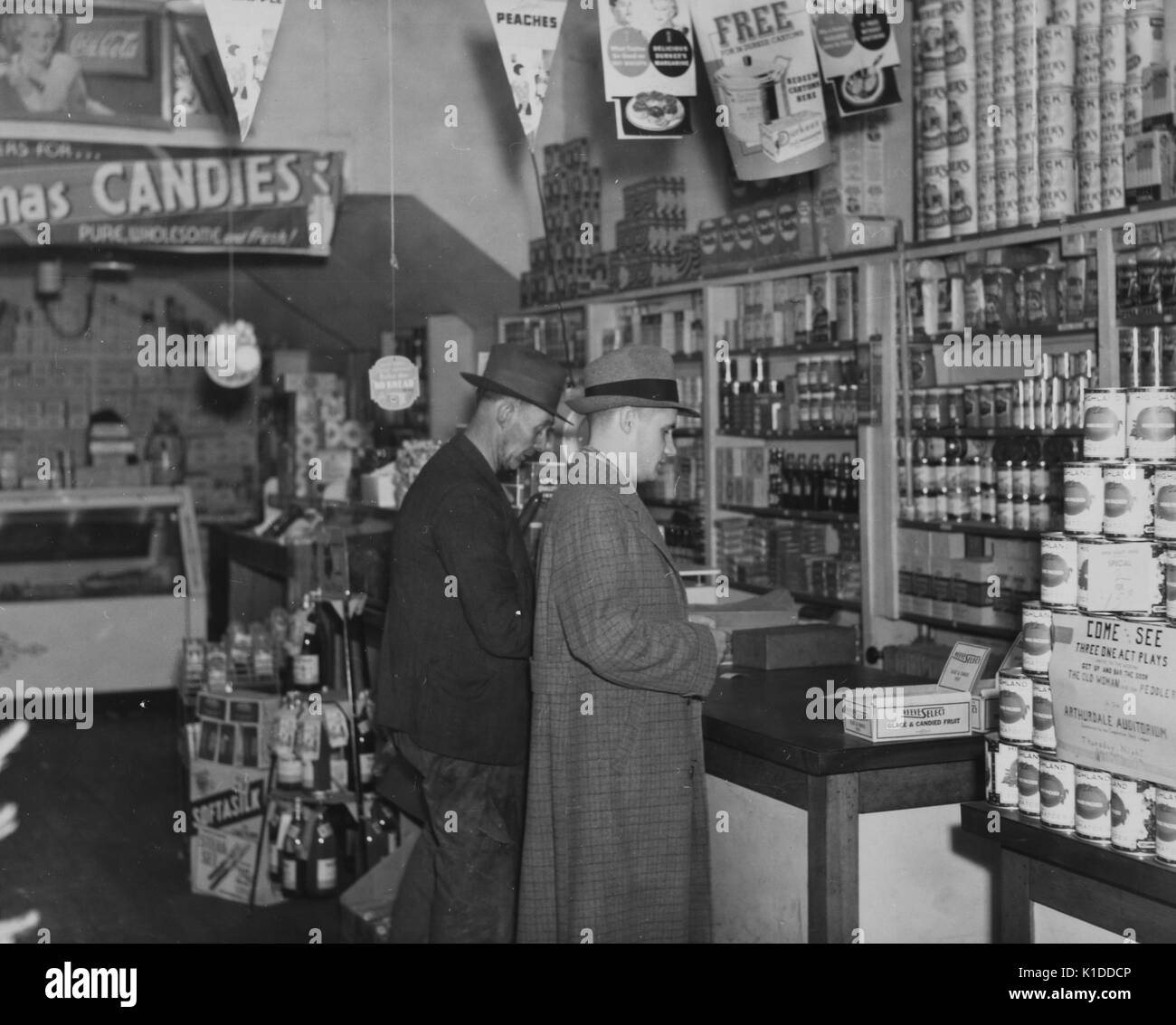 Men in suits shopping at cooperative store of Arthurdale project in Reedsville, West Virginia, Virginia, 1936. From the New York Public Library. Stock Photo