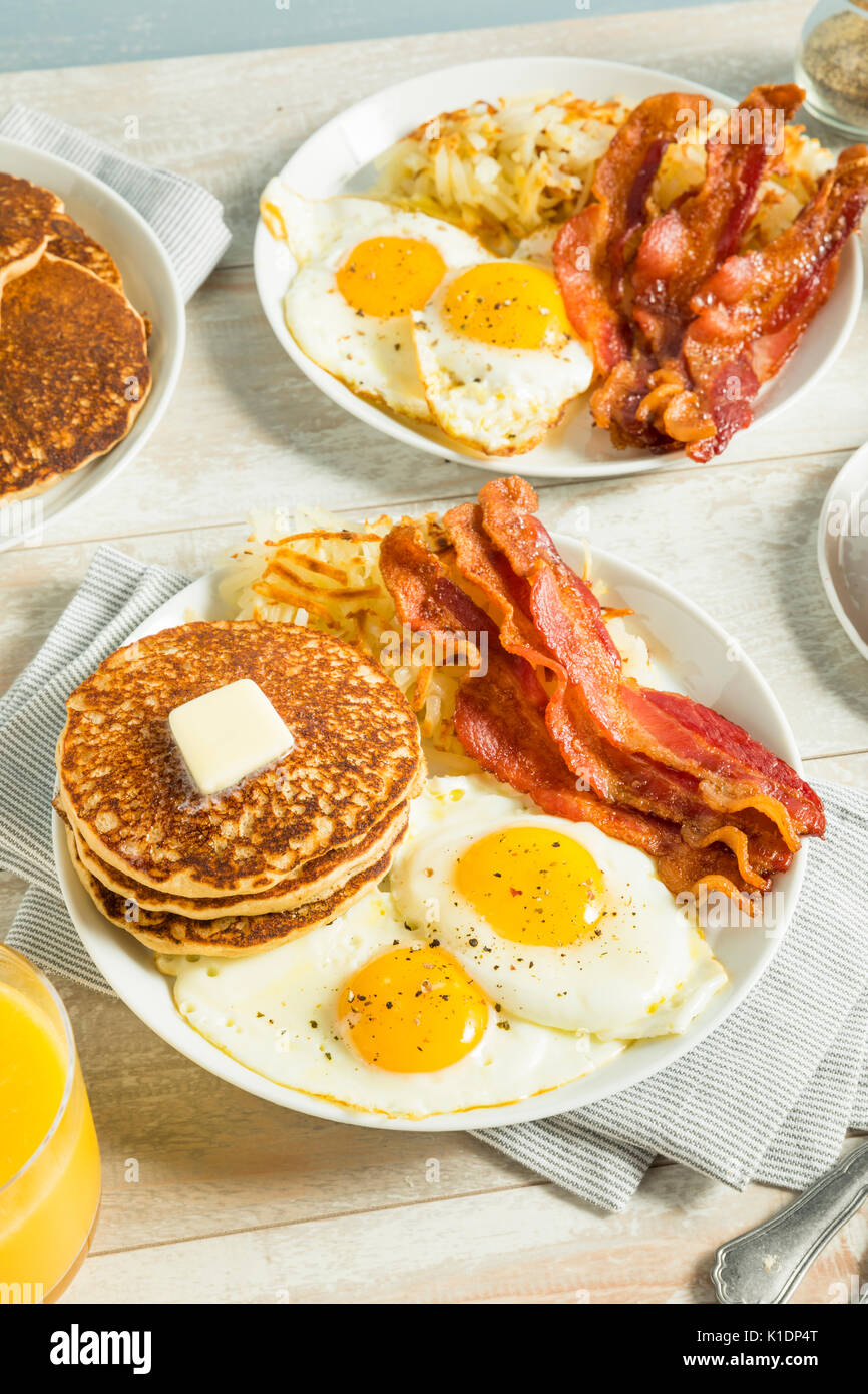 Healthy Full American Breakfast with Eggs Bacon and Pancakes Stock Photo