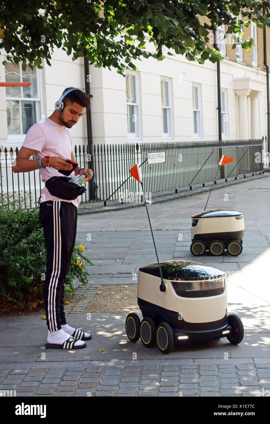 Borough, London, UK. 25th Aug, 2017. Food delivery robots made by Starship Technologies have gone on trial in London. The six-wheeled autonmous vehicles are being prepared to undertake take-out home deliveries for two major food outlets. At present they are accompanied by human handlers. Please credit pictures by (C) Credit: Jeffrey Blackler/Alamy Live News Stock Photo