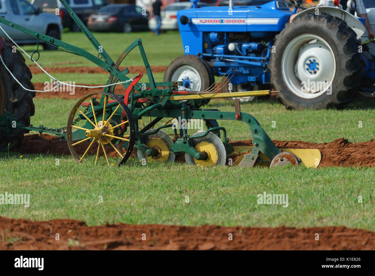 DUNDAS, PRINCE EDWARD ISLAND, CANADA - 25 Aug: Competitors plow with antique tractors at the PEI Plowing Match and Agricultural fair on August 25, 201 Stock Photo