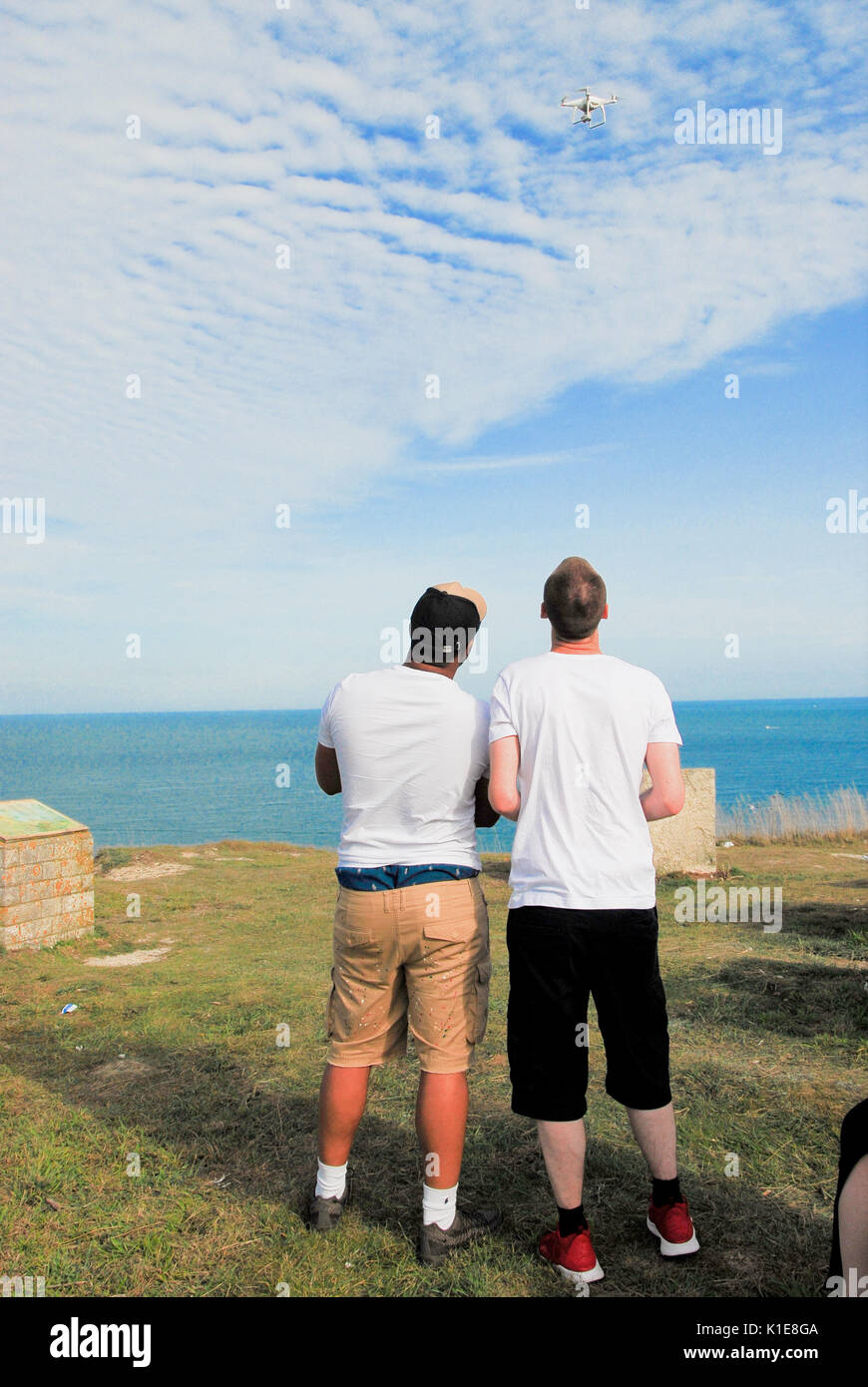 Portland Bill, Dorset, UK . 26th August 2017 - Two London guys enjoy filming with their drone at Southwell, Isle of Portland Credit: stuart fretwell/Alamy Live News Stock Photo