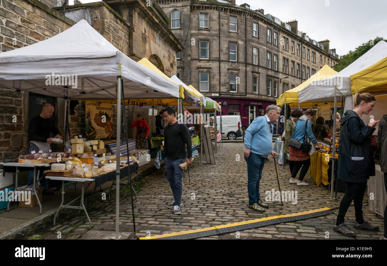 Dock Place, Leith, Edinburgh, Scotland, UK. Food and craft stalls at Leith Saturday market, with people browsing stalls Stock Photo