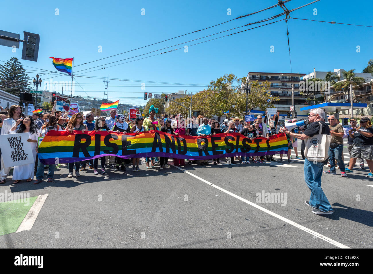 San Francisco, USA. 26th August, 2017, the No Hate rally and protest march in San Francisco. Longtime AIDS and LGBT activist Cleve Jones speaks to protesters gathered at Harvey Milk Plaza in San Francisco's Castro district before marching down Market Street to San Francisco City Hall. Originally planned as one of several counter protests to a previously planned demonstration by far right group 'Patriot Prayer,' protested alt right politics and recent statments by President Trump including Charlottesville, banning trans-gendered people from the military Credit: Shelly Rivoli/Alamy Live News Stock Photo