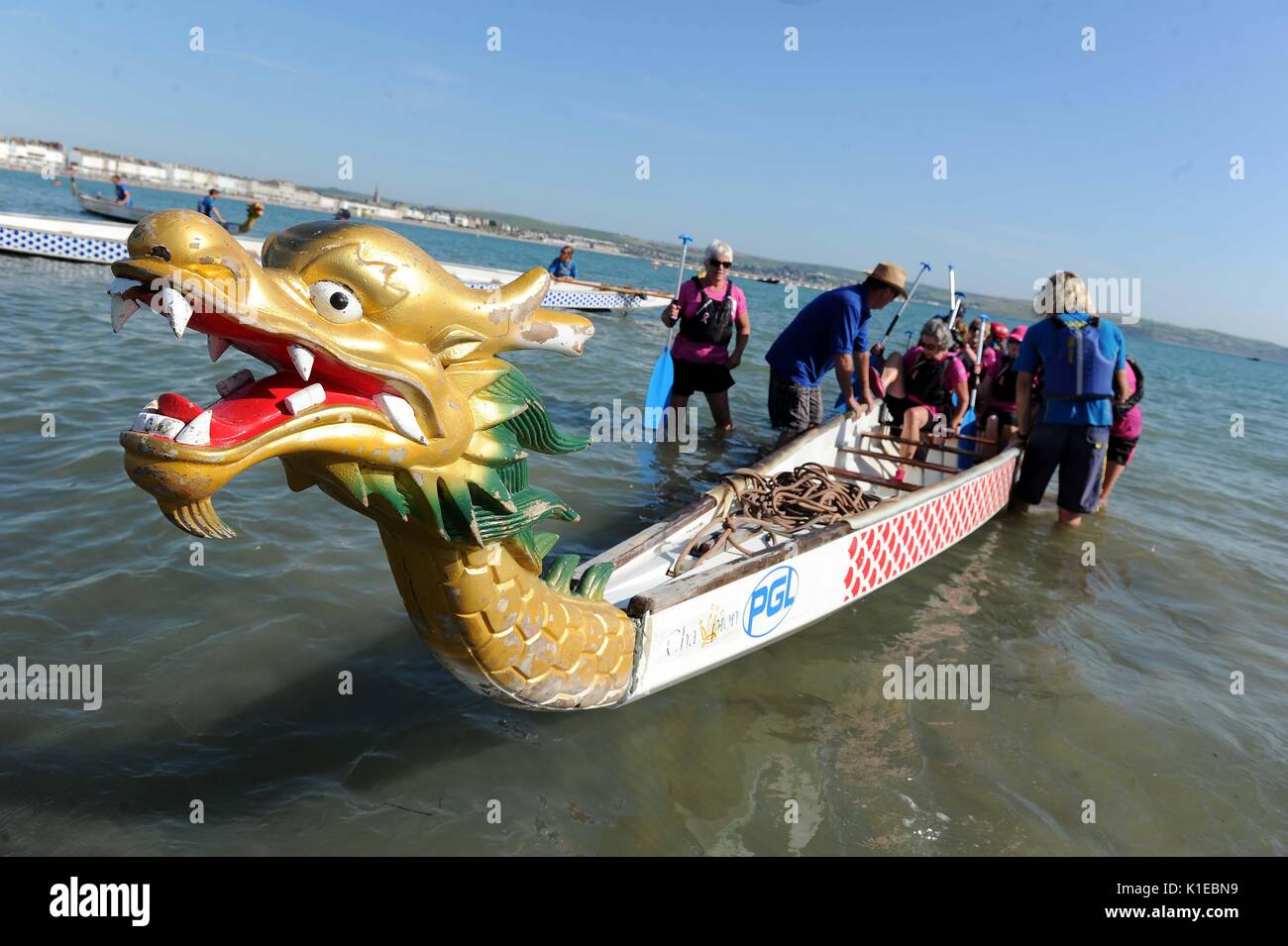 Bank Holiday Dragon Boat racing. Weymouth, Dorset, UK Credit: Finnbarr Webster/17�Թ����� Live News Stock Photo