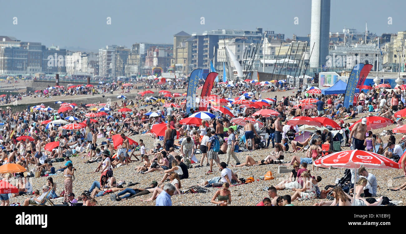 Brighton, UK. 27th Aug, 2017. Crowds enjoy the beautiful hot sunny