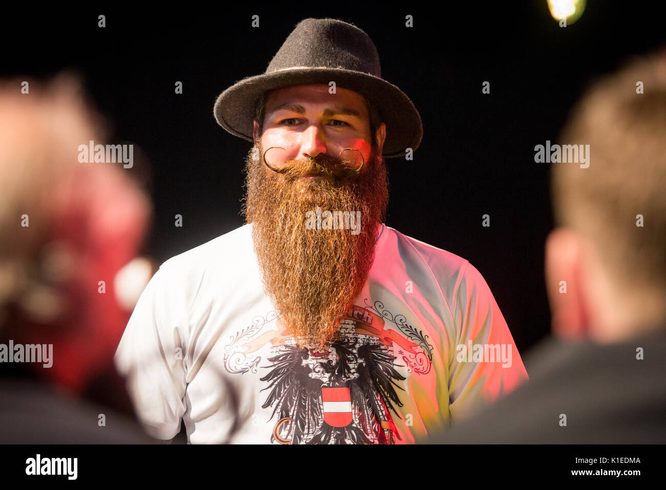 Stuttgart, Germany. 27th Aug, 2017. Marc Bereiter, participant of the Swabian Beard Championships for everyone, presents his beard to the jury during the brewery festival of the brewery 'Stuttgarter Hofbräu' in Stuttgart, Germany, 27 August 2017. Shortly thereafter, Bereiter won the championship. Photo: Christoph Schmidt/dpa/Alamy Live News Stock Photo