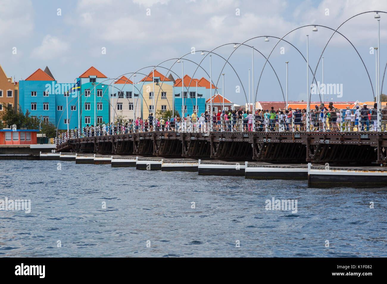 Willemstad, Curacao, Lesser Antilles.  Pedestrians Crossing Queen Emma Pontoon Bridge. Stock Photo