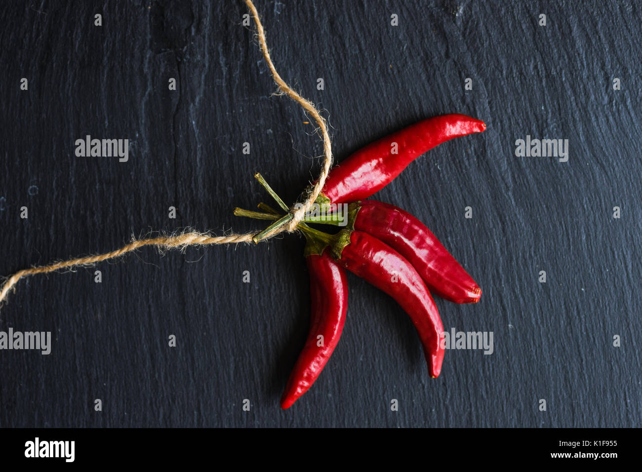 Red hot chilli peppers on dark background with copyspace Stock Photo ...