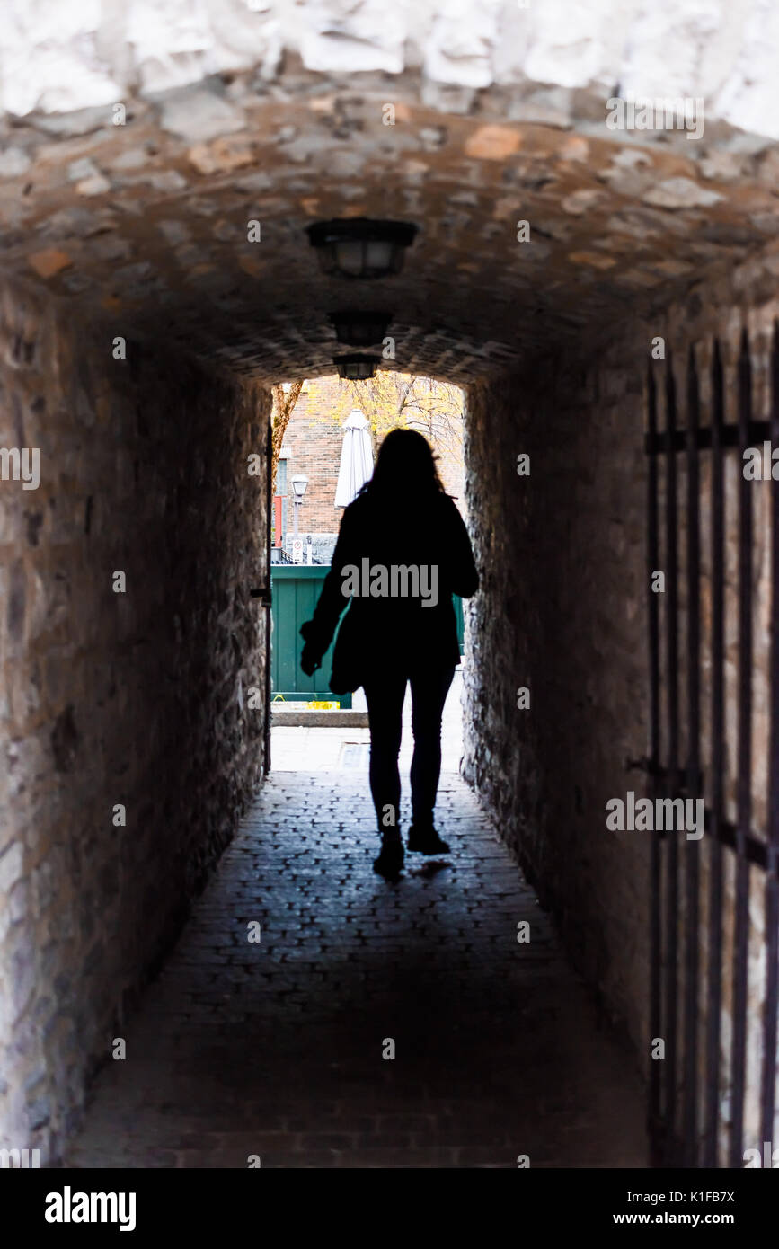 Lower old town with cobblestone street narrow alley Passage De La Batterie  with light lamp and woman person tourist walking in Quebec City, Canada  Stock Photo - Alamy