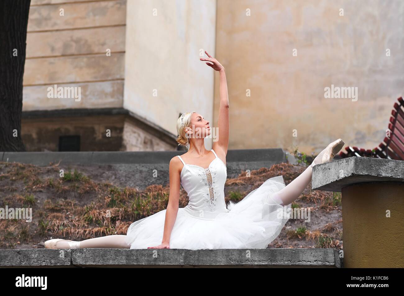 Beautiful graceful ballerina dancing on the streets of an old ci Stock ...