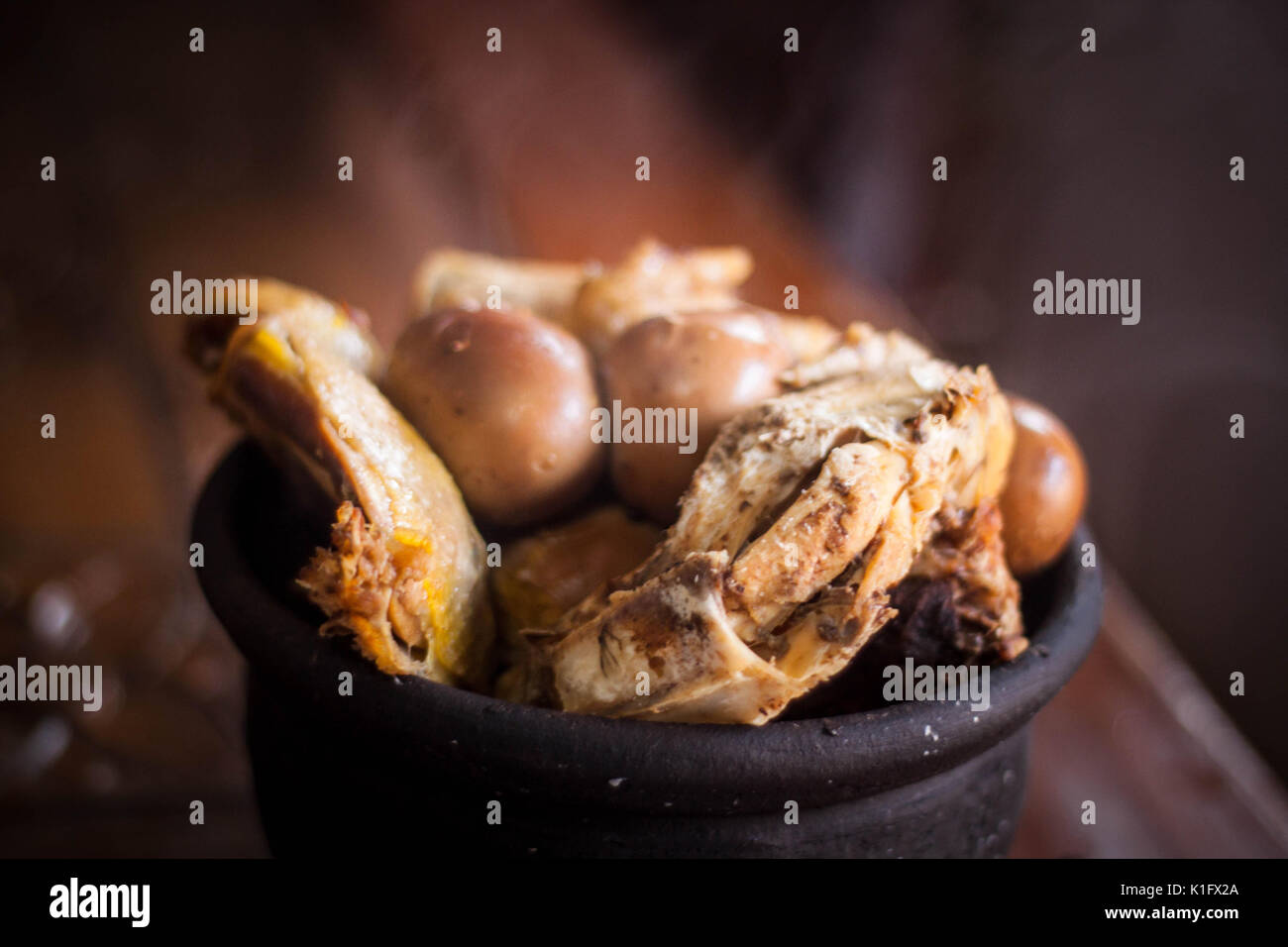 gudeg traditional exotic indonesian food with kendil and wooden table Stock Photo
