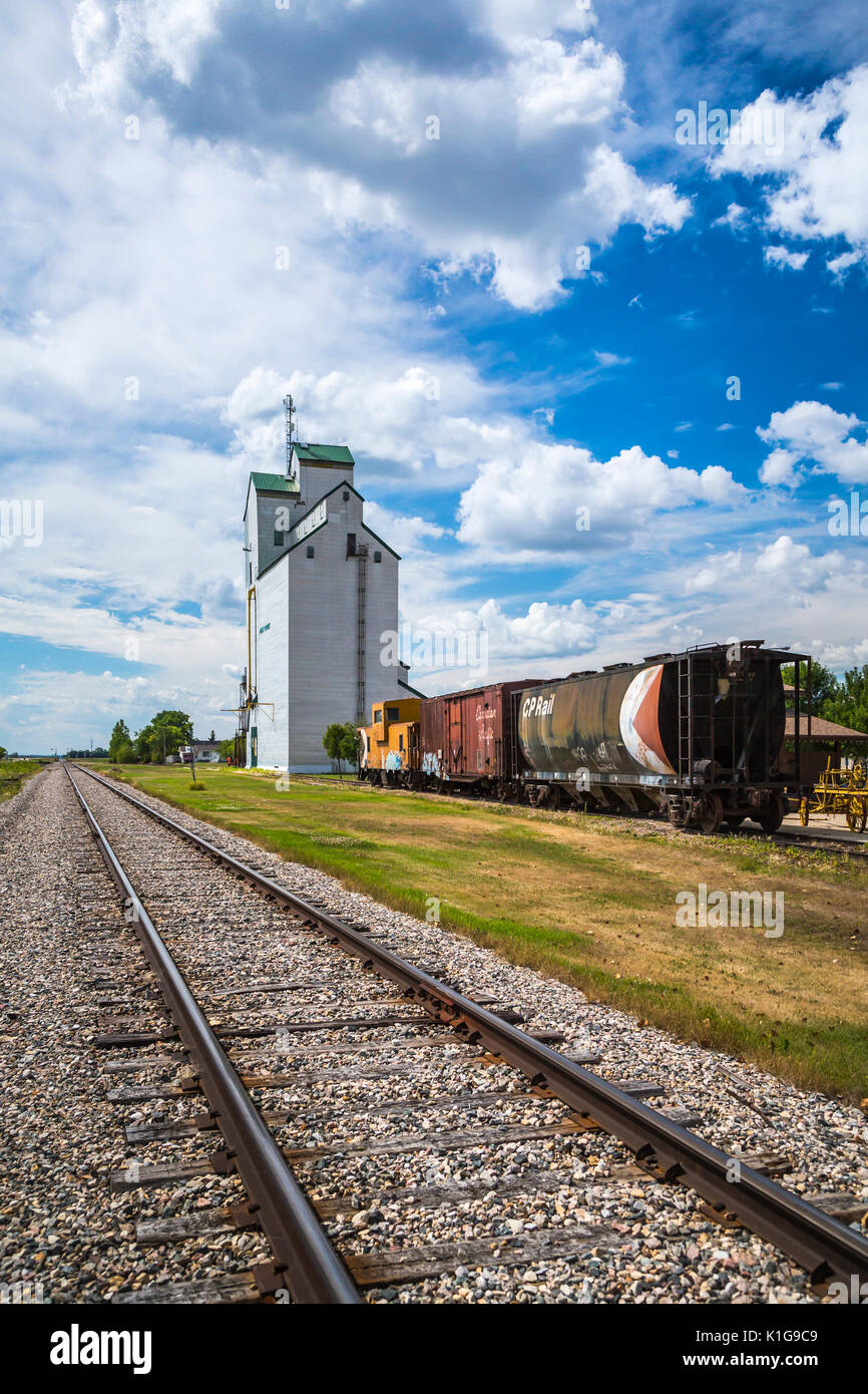 The historic grain elevator and train cars in Plum Coulee, Manitoba