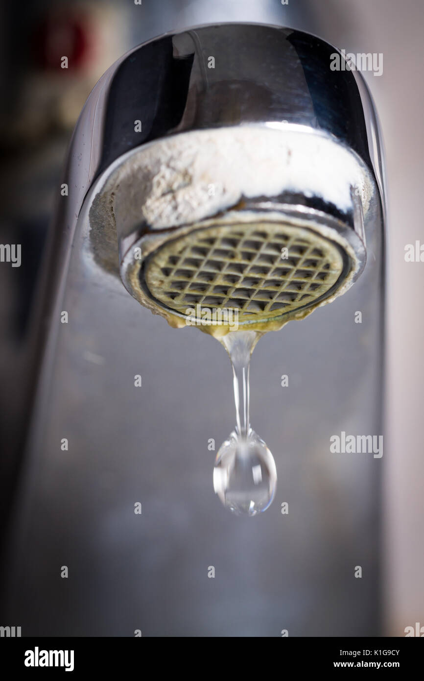 Old Leaking Faucet With Stone And Calcium Sediments Due To Hard
