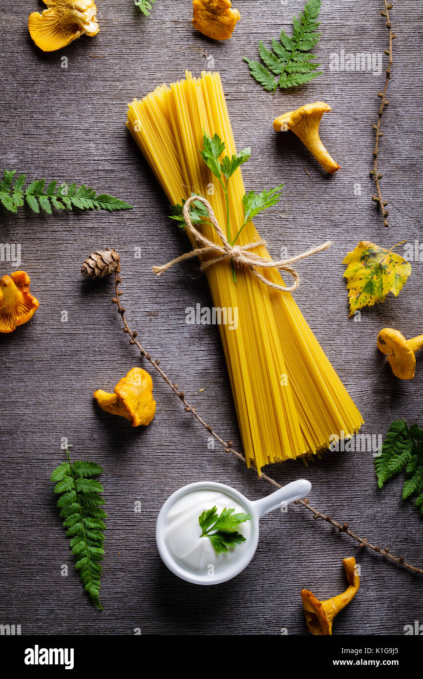 Ingredients for spaghetti with yellow mushroom (chanterelle) fungus sauce Stock Photo Alamy