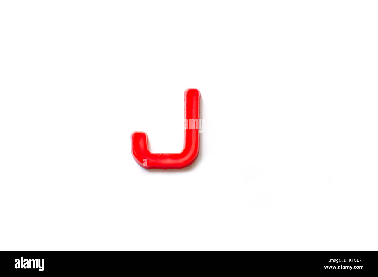 Plastic letters J isolated white background Stock Photo - Alamy
