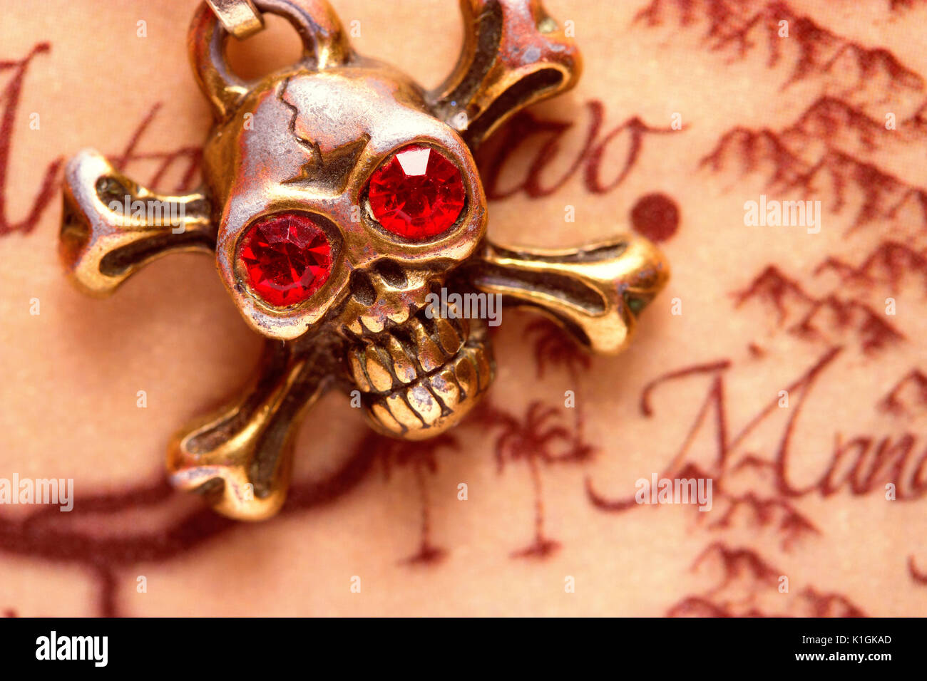close up of metal skull with red eyes. pirate concept Stock Photo