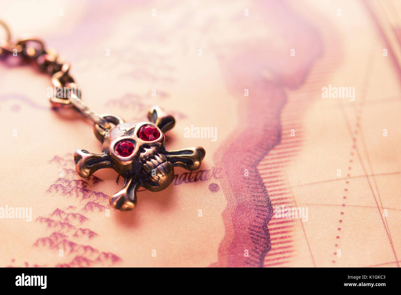 close up of metal skull with red eyes. pirate concept Stock Photo