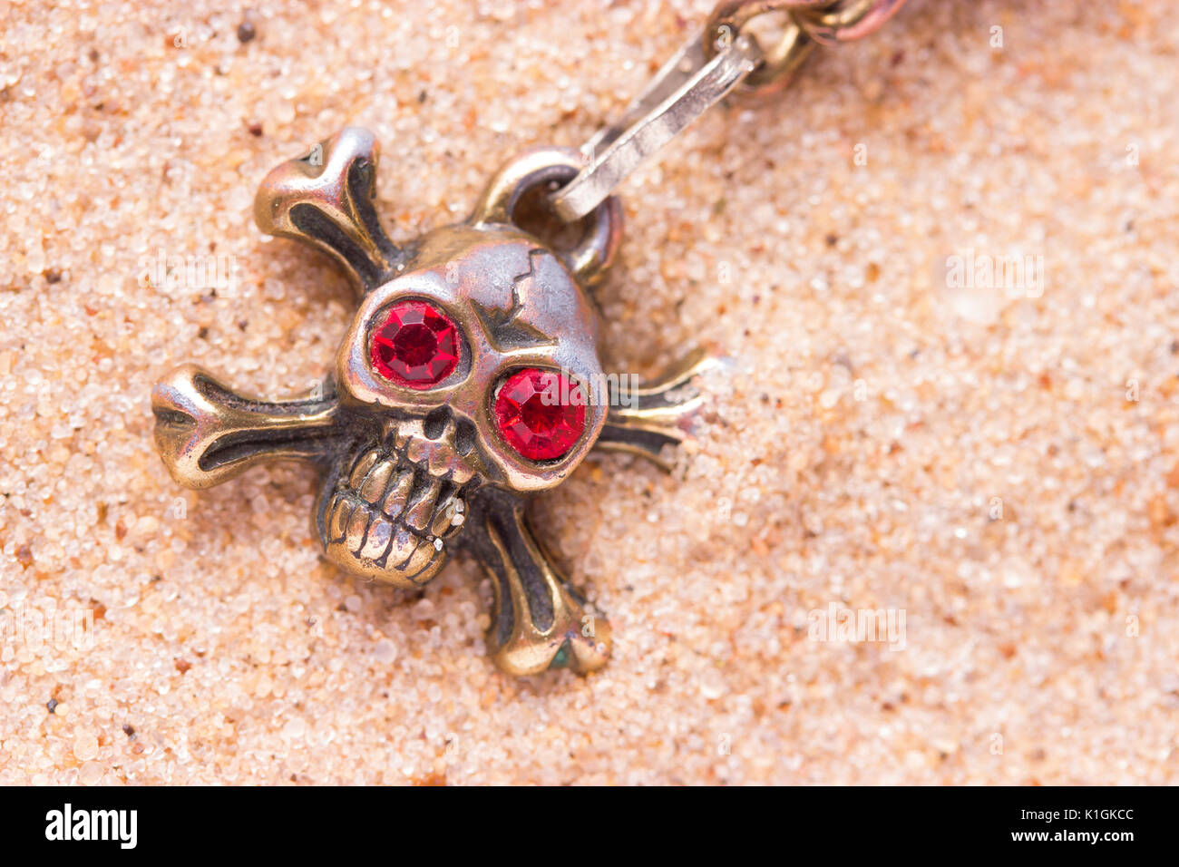 close up of metal skull with red eyes. pirate concept Stock Photo