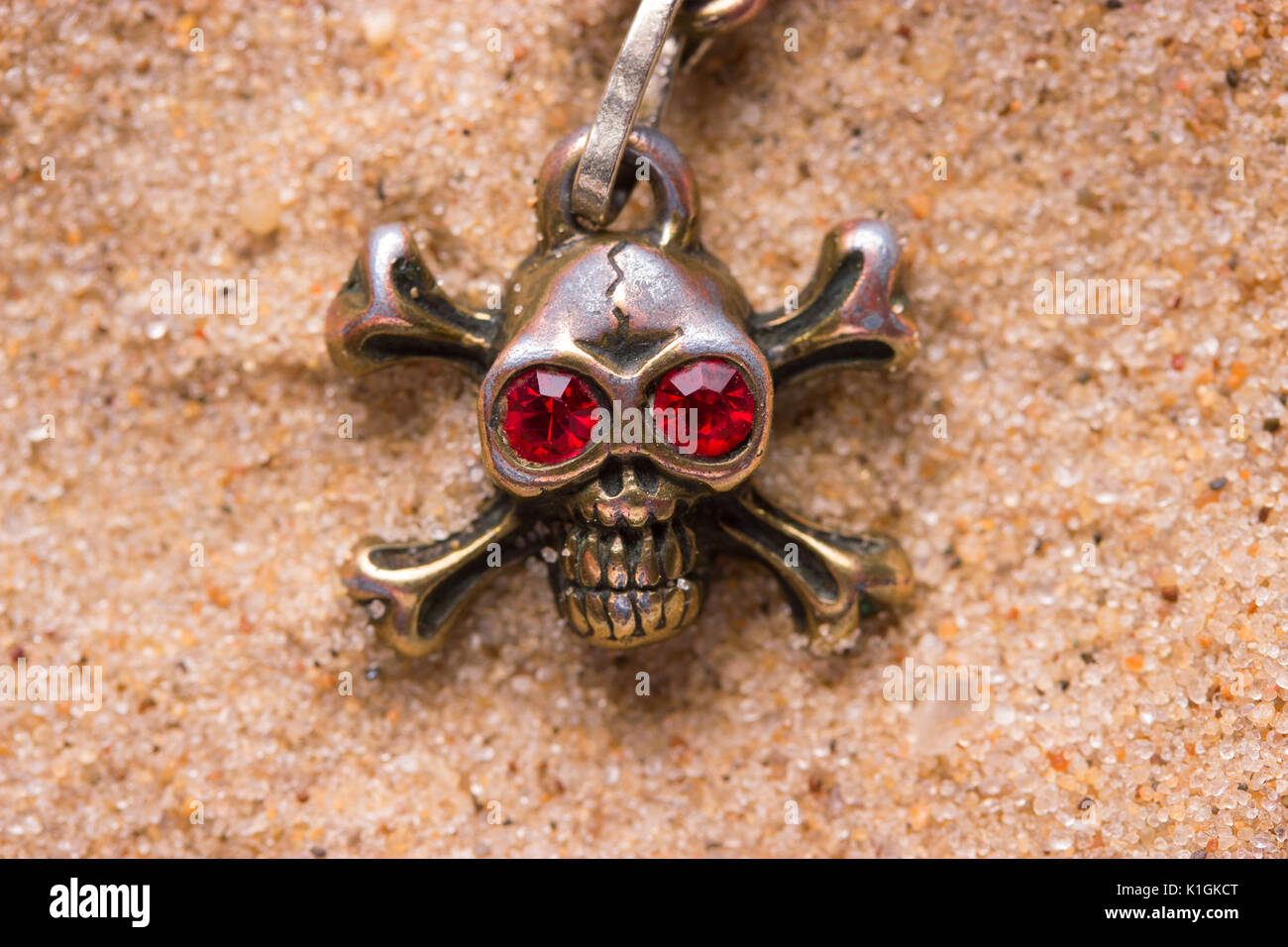 close up of metal skull with red eyes. pirate concept Stock Photo