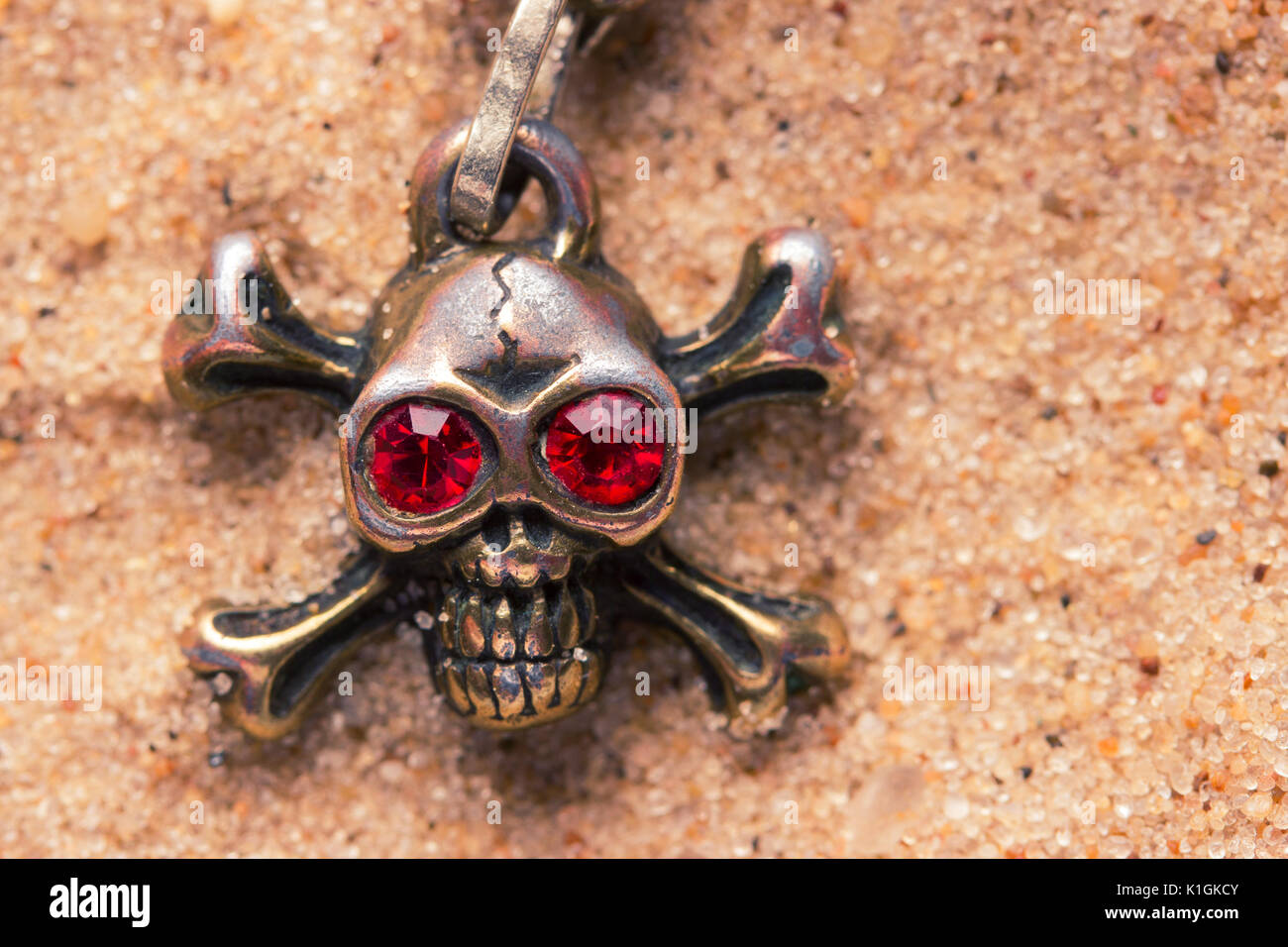 close up of metal skull with red eyes. pirate concept Stock Photo