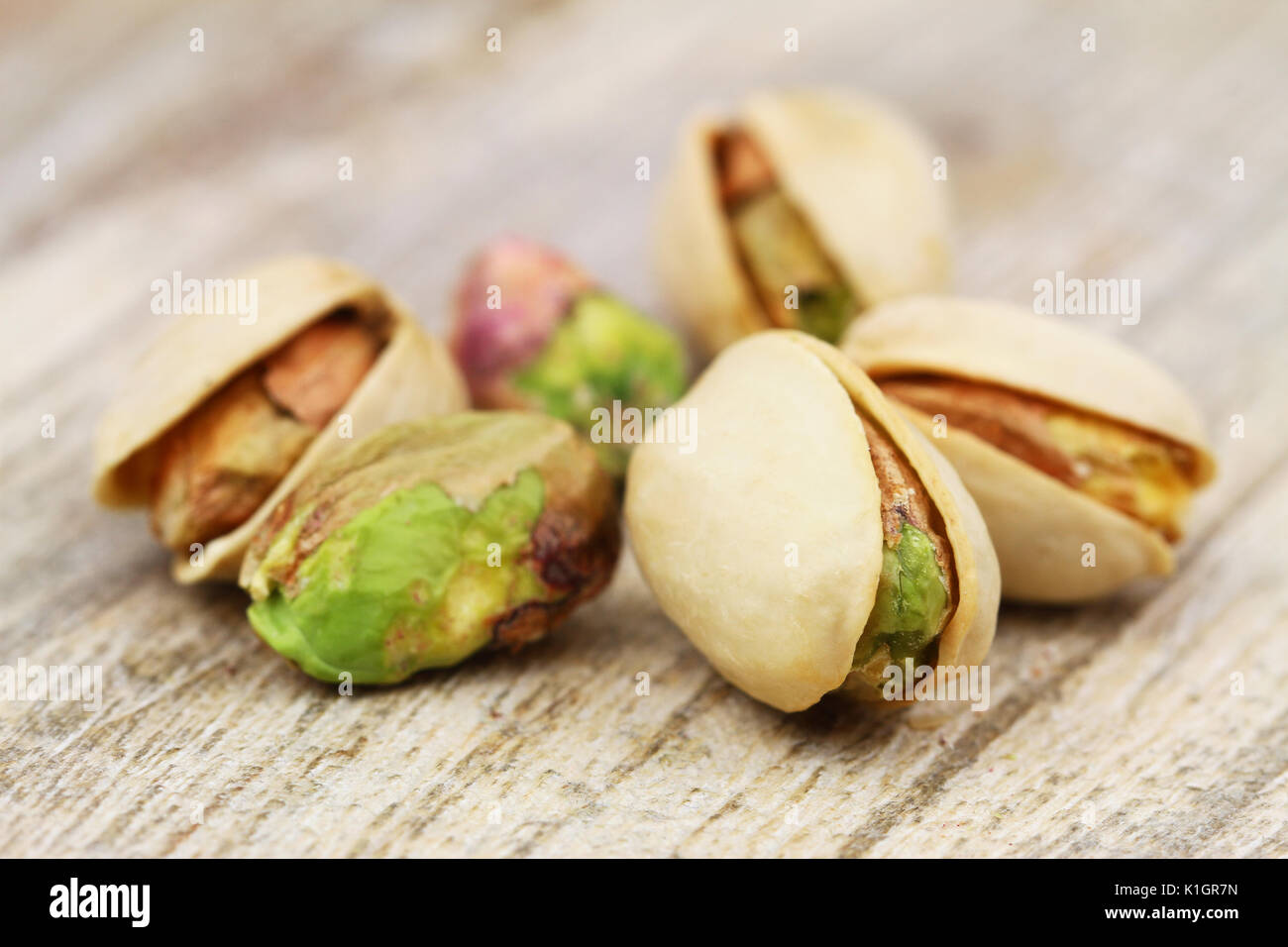 Pistachio nuts with and without shell, closeup Stock Photo