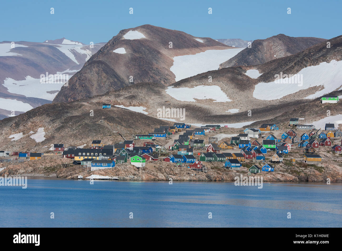 Greenland, Scoresbysund, Ittoqqortoormiit (70°28'43' N 21°57'44' W) Coastal view of typical colorful houses of remote Greenlandic settlement, founded  Stock Photo