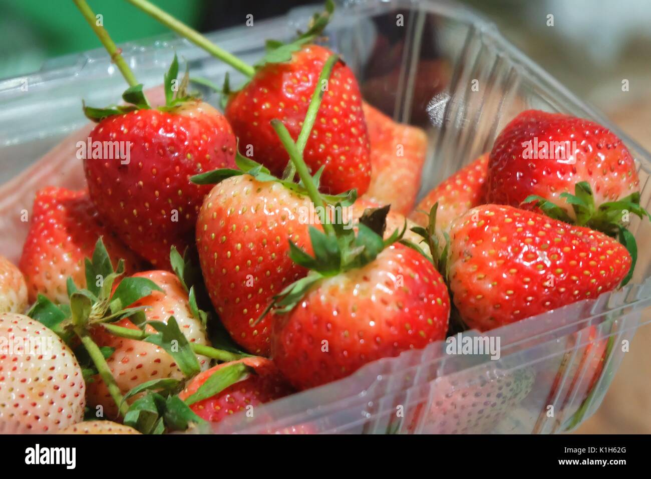 Fresh Fruit, Close Up of Ripe and Sweet Strawberry in Plastic Box, High in Vitamin C Tablet, Essential Nutrient for Life. Stock Photo